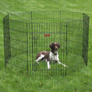 Dog inside a black metal pet playpen on grass