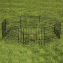 Black metal pet playpen on a grassy field