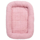 Pink pet bed with a soft texture on a white background