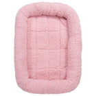 Pink pet bed with a soft texture on a white background