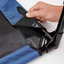 Hand adjusting a black strap on a blue and gray bag against a white background