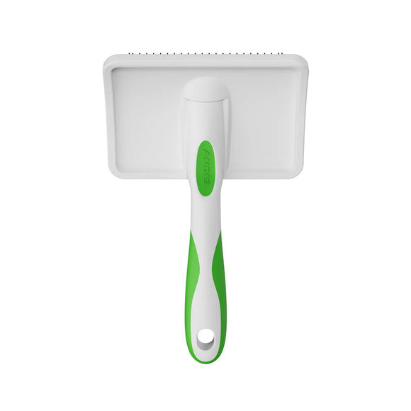 White pet grooming brush with green handle on a white background