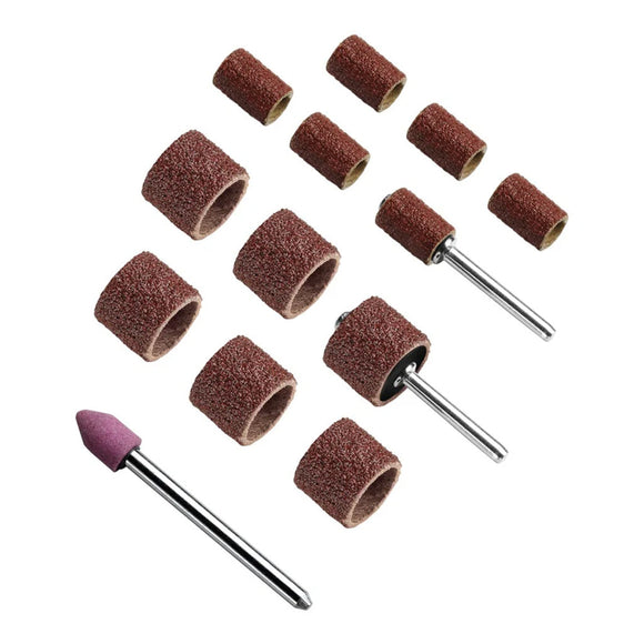 Set of sanding drums and attachments on a white background