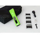 Green hair trimmer with attachments and cable on a white background