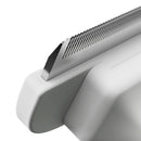 Close-up of a metallic object with a textured surface on a white background