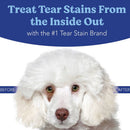 Advertisement for a tear stain treatment product with a white dog and text about treating tear stains.
