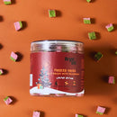 Jar of freeze-dried cat grass with cranberry on an orange background