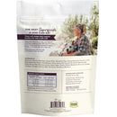 Dog food packaging with a woman and dog on a white background