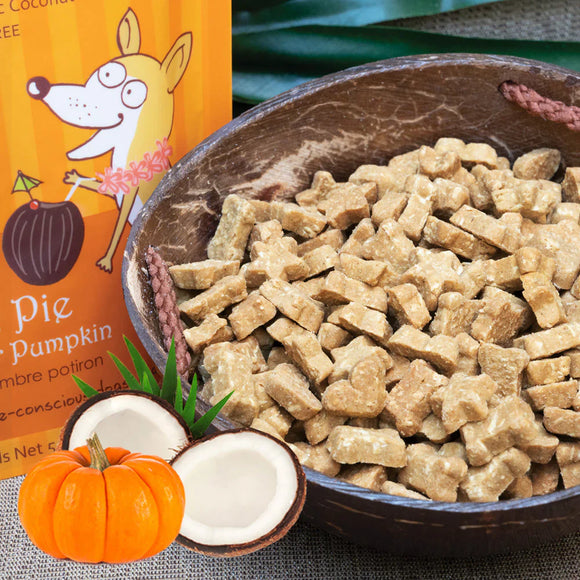 Bowl of dog treats with a packaging of 'Pie & Pumpkin' treats in the background.