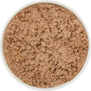 Close-up of a bowl filled with brown food on a white background
