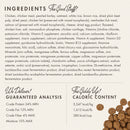 Dog food ingredient list and guaranteed analysis on a label with a small pile of dog food.
