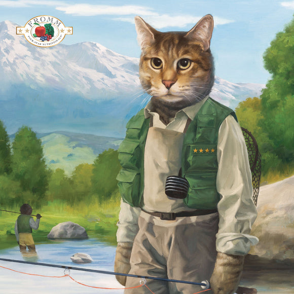 Cat in fishing attire with a scenic background featuring mountains and trees.
