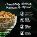 Dog food in a glass bowl with text highlighting features on a black background