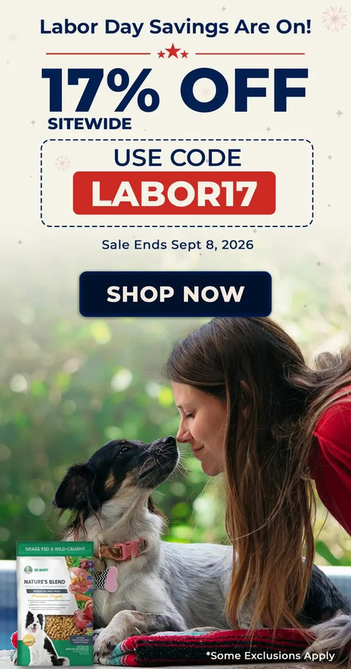 A green and white bag of nature’s blend dog food with a black, white, and tan puppy on the front.