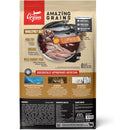 Orijen dog food package with various ingredients on a beige background