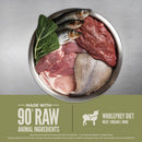 Raw meat, fish, and vegetables in a bowl with Wholeprey Diet branding.