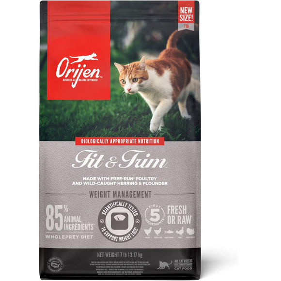 Orijen Fit & Trim cat food package with a cat on grass