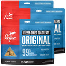 Orijen freeze-dried dog treats packaging with blue and red design.