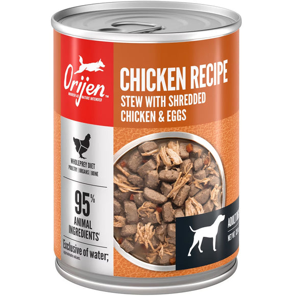 Orijen canned chicken recipe dog food with shredded chicken and eggs on an orange label.