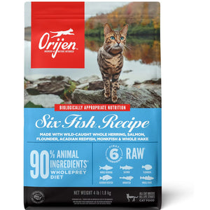 Orijen cat food package with a cat on rocks by a lake