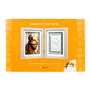 Pawprints desk frame packaging with a dog's pawprint and photo on an orange background