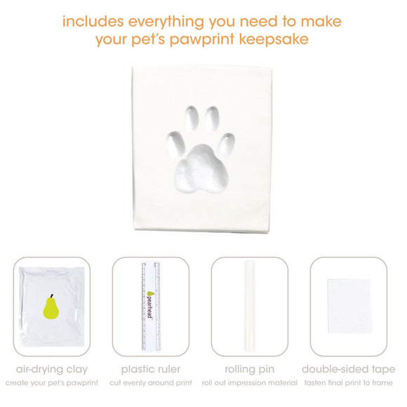 Pet pawprint keepsake kit with air-drying clay, plastic ruler, rolling pin, and double-sided tape on a white background.