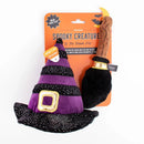 Halloween-themed dog toy with witch hat and broomstick on a white background