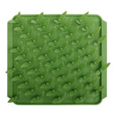 Green silicone mat with textured surface on a white background
