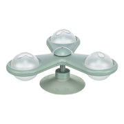 Green silicone ice cube tray with four round compartments on a white background
