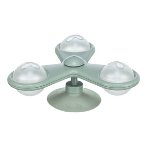 Green silicone ice cube tray with four round compartments on a white background