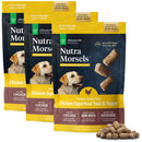 Three packages of Nutra Morsels freeze-dried raw chicken superfood treat and topper with a small pile of treats in front.