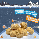 Dog treats with 'Drool-worthy Flavors' text and ingredients on a snowy background, featuring the Lazy Dog Cookies brand.