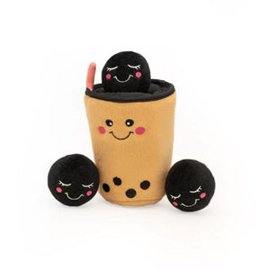 Toy set with a cup and three black balls on a white background