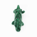 Green plush alligator toy on a white background