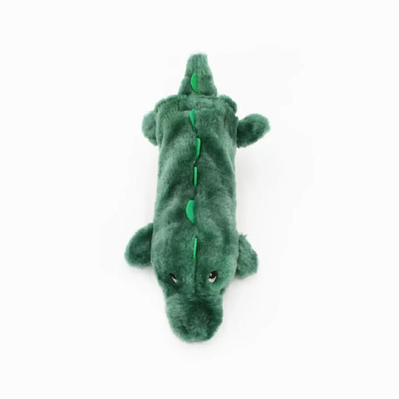 Green plush alligator toy on a white background