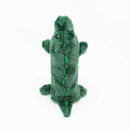 Green plush alligator toy on a white background