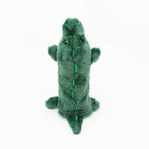 Green plush alligator toy on a white background