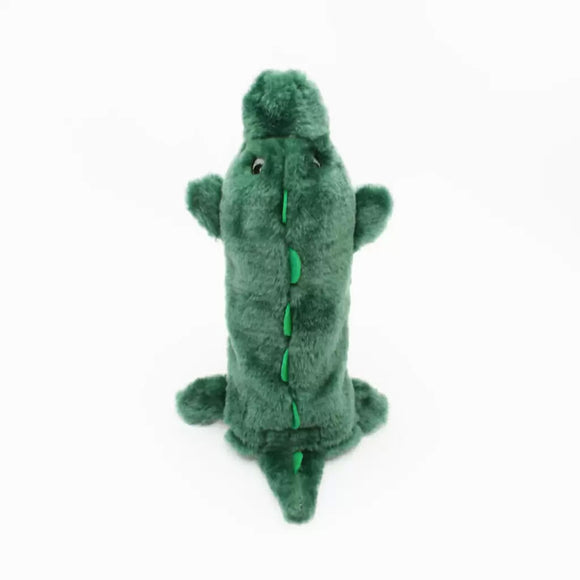 Green plush alligator toy on a white background