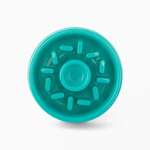 Turquoise plastic component on a white background