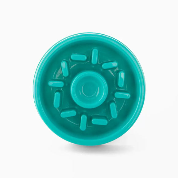 Turquoise plastic component on a white background