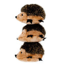 Stack of three plush hedgehogs on a white background
