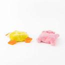 Two plush toys, one yellow and orange, the other pink, on a white background.
