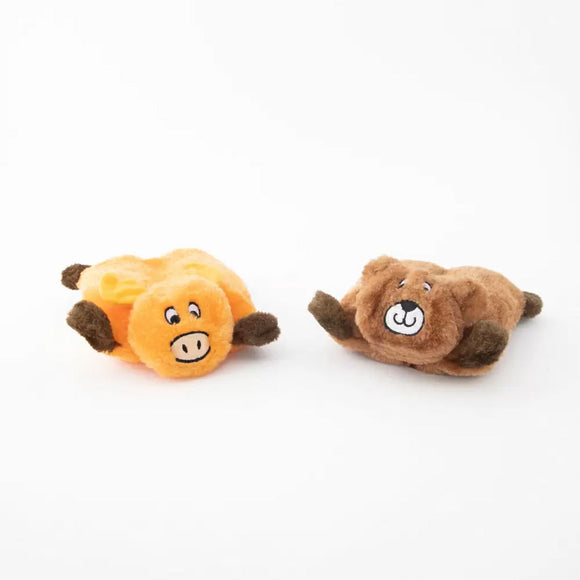 Two plush toys, one orange and one brown, on a white background