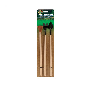 Packaged terrarium tools with a brush, fork, and shovel on a white background